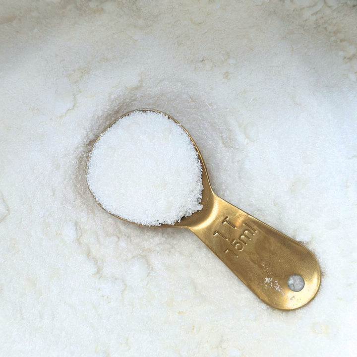 Natural laundry powder with eucalyptus and lavender in a kraft pouch.