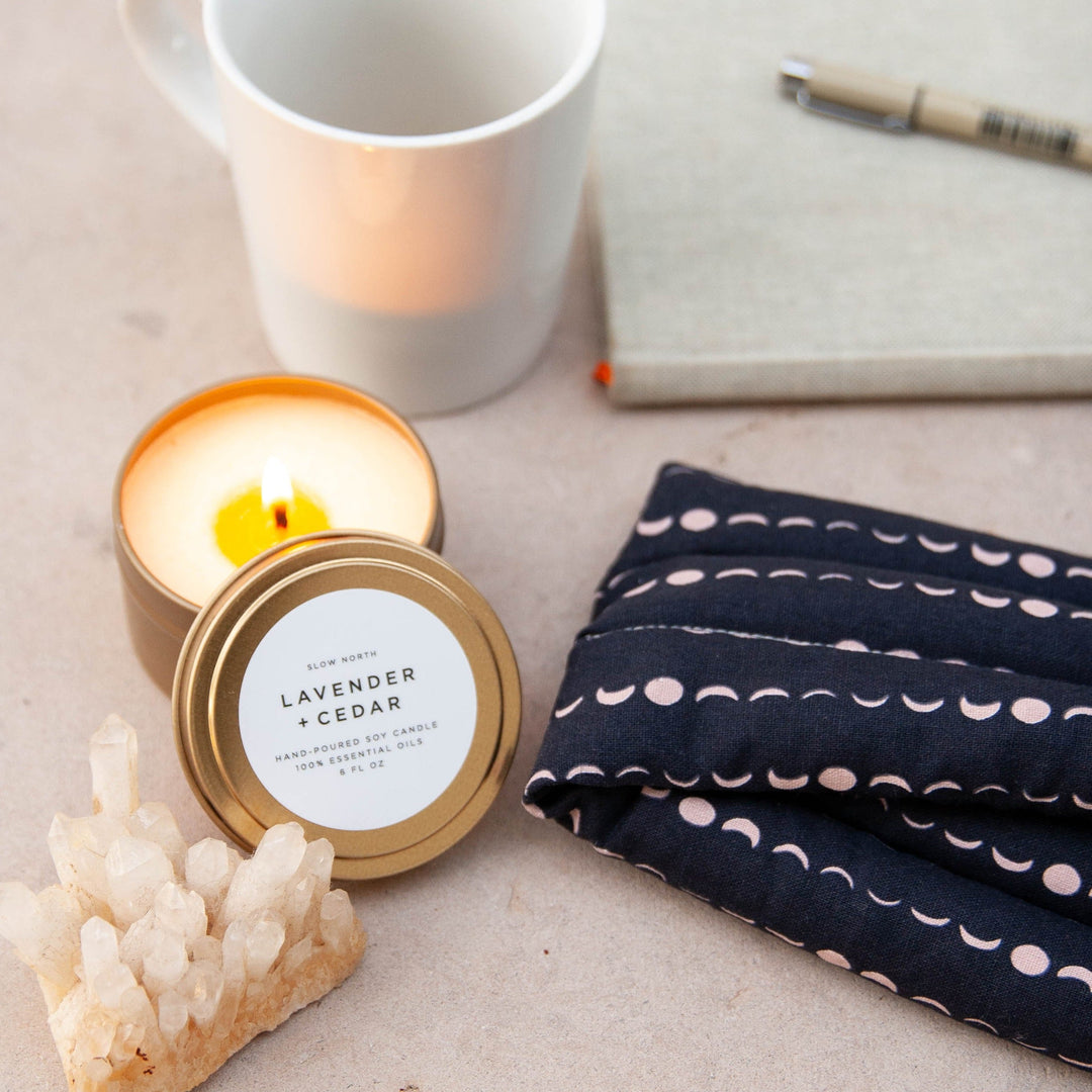 Lavender cedar soy candle in a brushed gold travel tin.