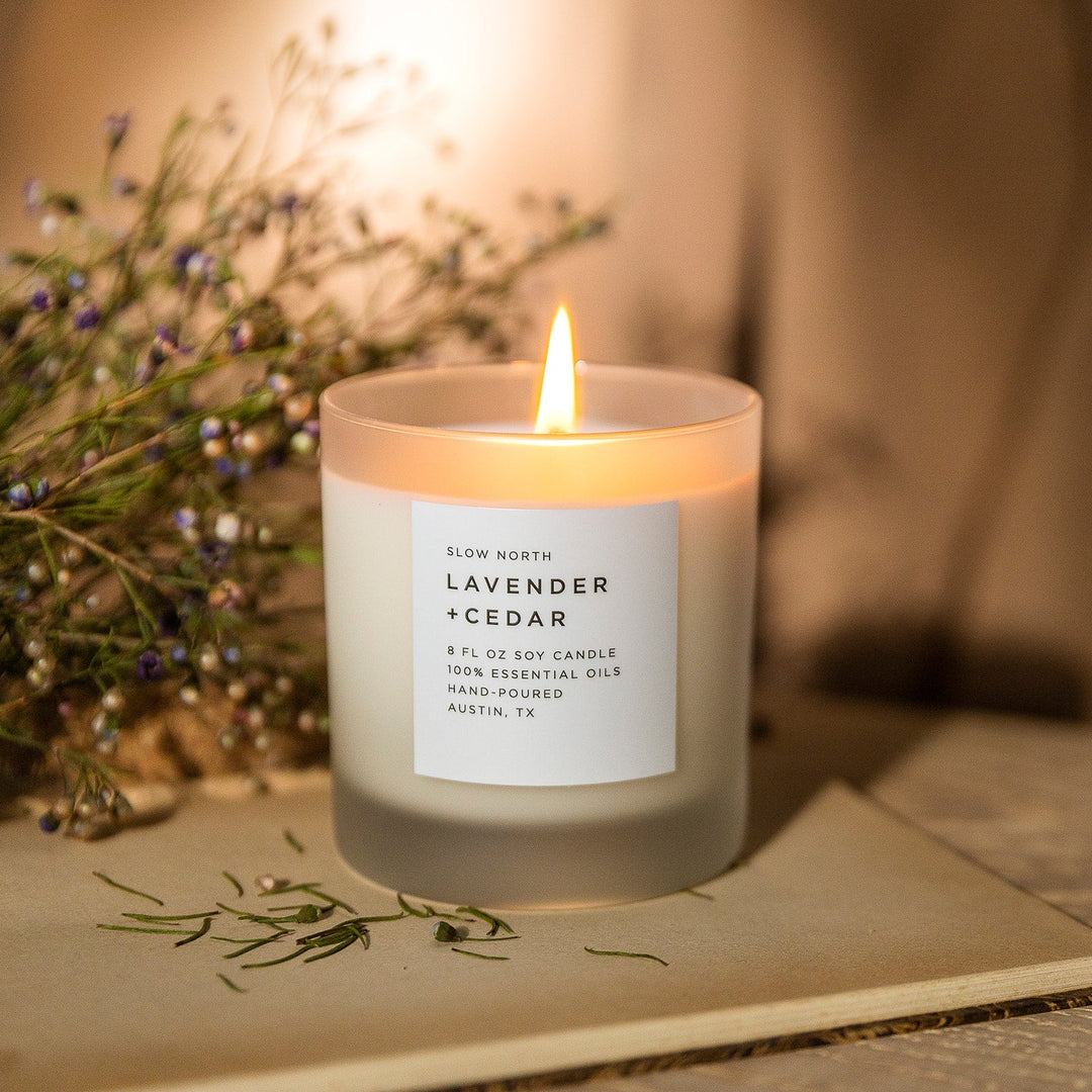 8 oz Lavender Cedar signature candle with essential oils in a clear glass jar.