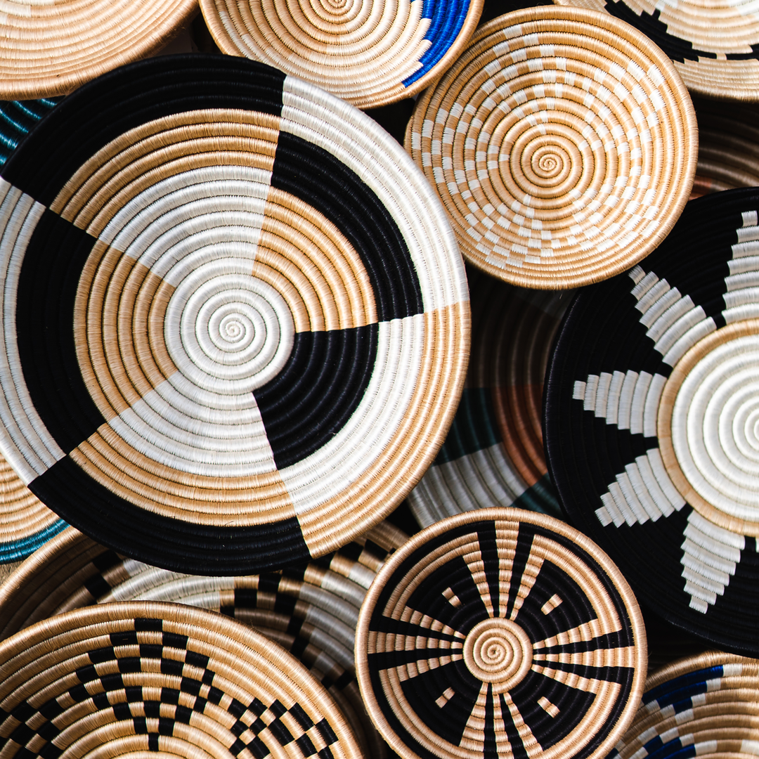 Stacked Staccato woven bowls in natural sisal with quarter-pinwheel patterns.