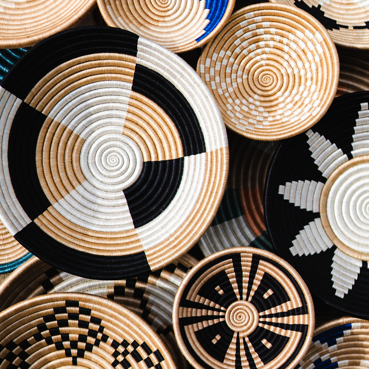 Stacked Staccato woven bowls in natural sisal with quarter-pinwheel patterns.