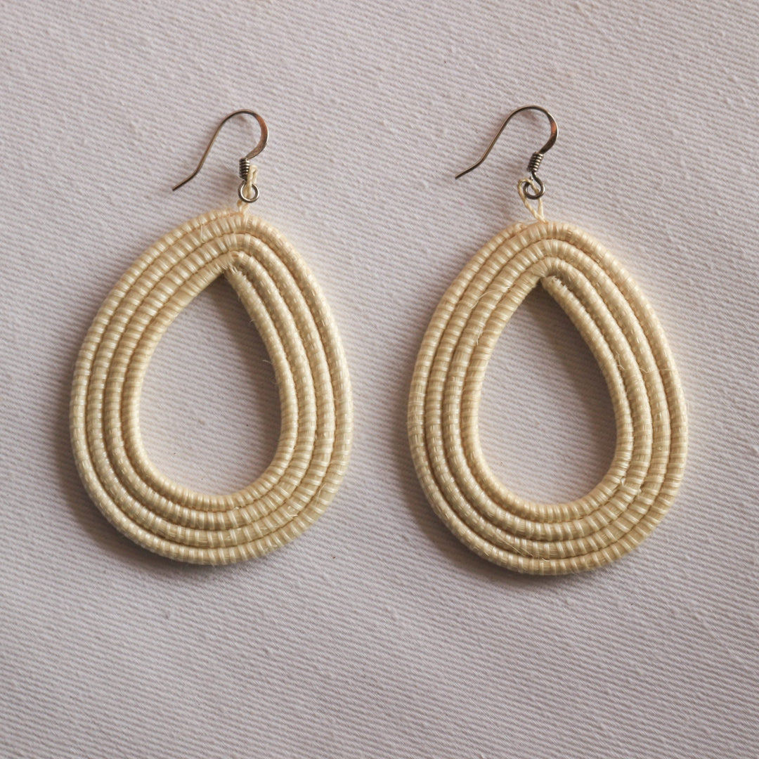 Natural sisal woven loop earrings with a lightweight, textured finish.