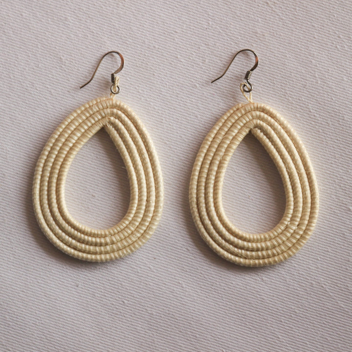 Natural sisal woven loop earrings with a lightweight, textured finish.