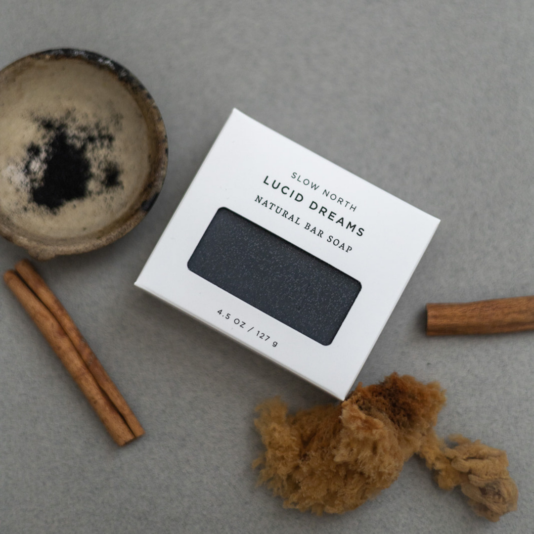 Activated charcoal bar soap in a sleek, rectangular black bar with textured surface.