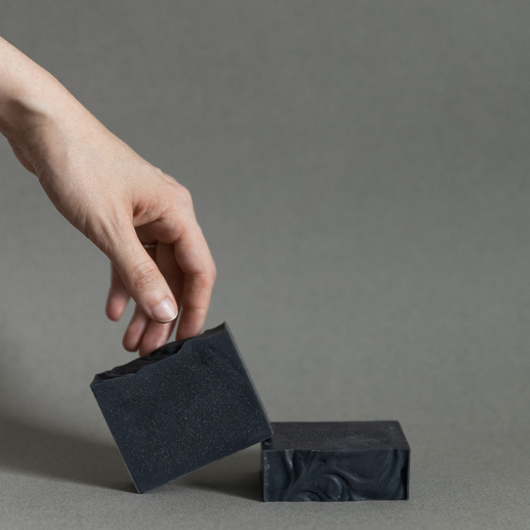 Activated charcoal soap with branded kraft packaging.