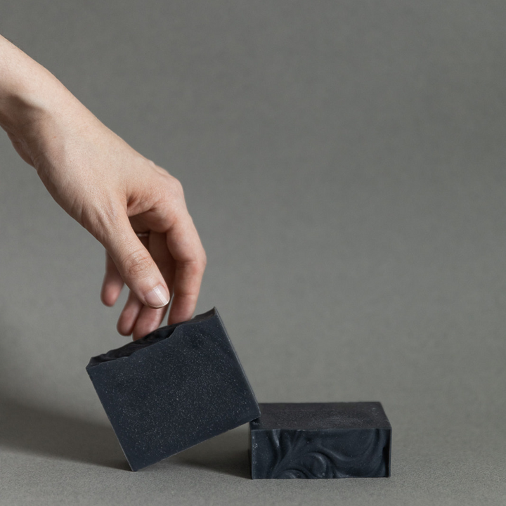 Activated charcoal soap with branded kraft packaging.