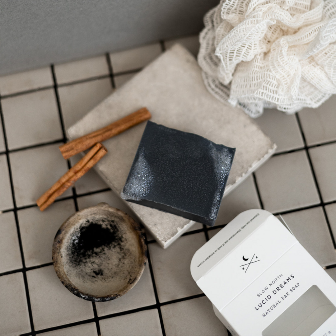 Lucid Dreams charcoal soap bar photographed on a neutral background.