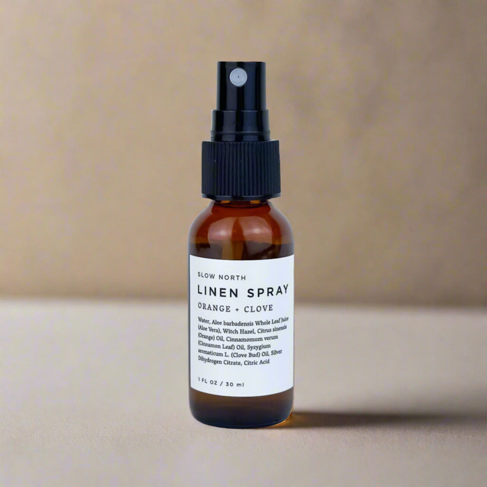 Mini linen spray with sweet orange, clove bud, and cinnamon leaf essential oils.
