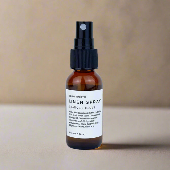 Mini linen spray with sweet orange, clove bud, and cinnamon leaf essential oils.