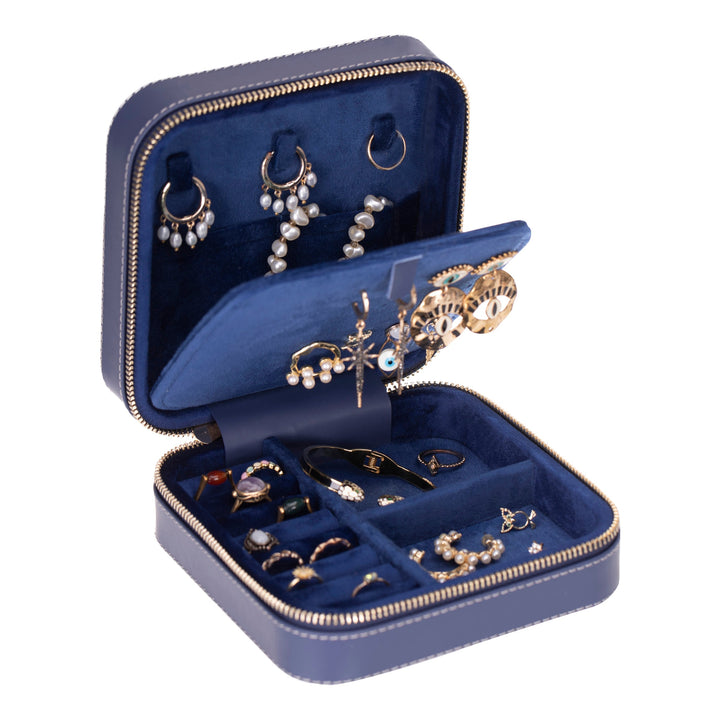 Handcrafted leather jewelry box with compartments for rings, necklaces, and earrings.