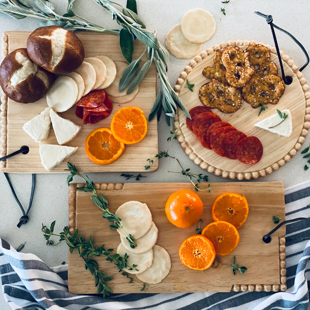 Hand-carved square mini serving board in pine, for cheese or small bites.