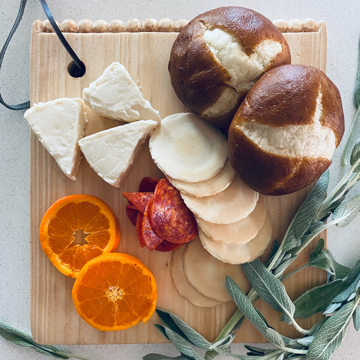 Hand-carved square pine mini serving board for snacks or cheese.