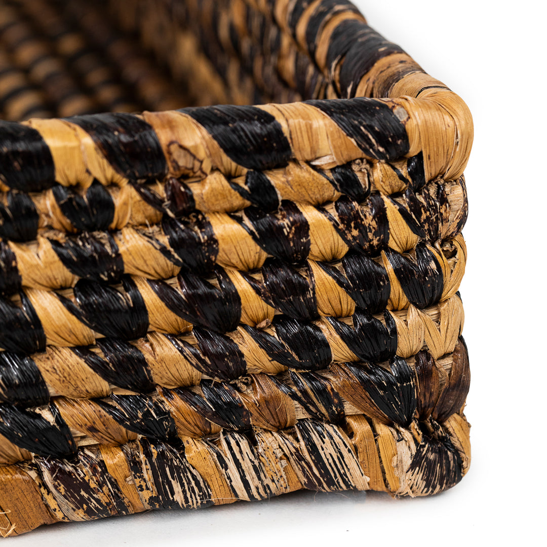 Handwoven banana leaf trays with intricate natural-fiber craftsmanship.
