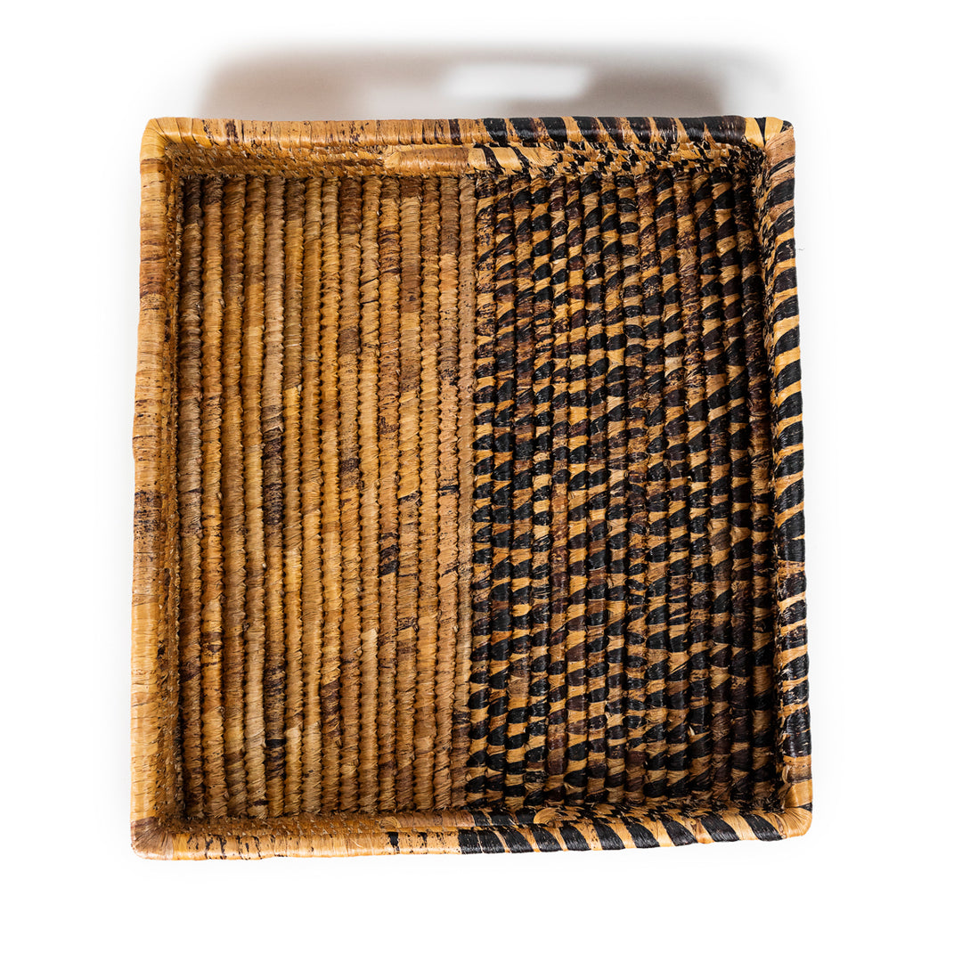 Handwoven banana leaf trays with natural patterns on a white background.