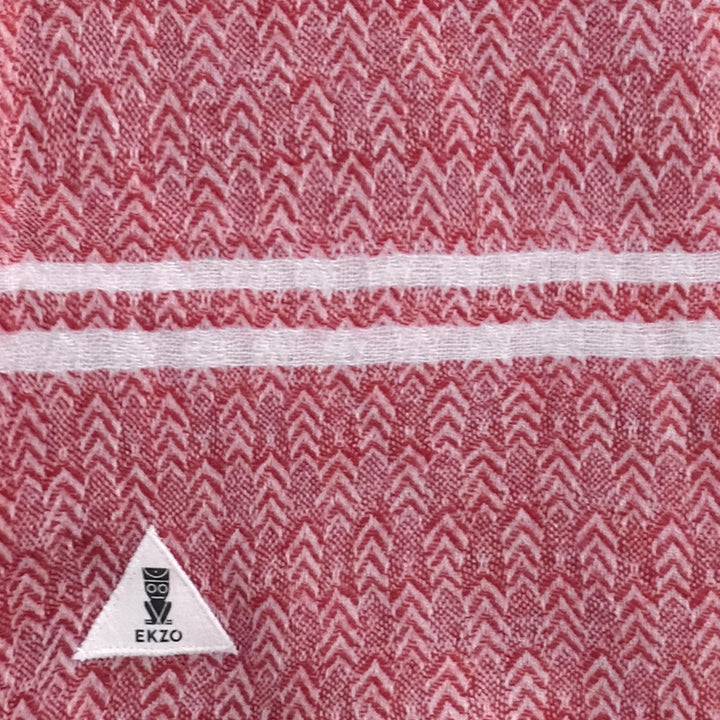 Close-up of a handwoven cashmere scarf in the Merry pattern with a soft texture.