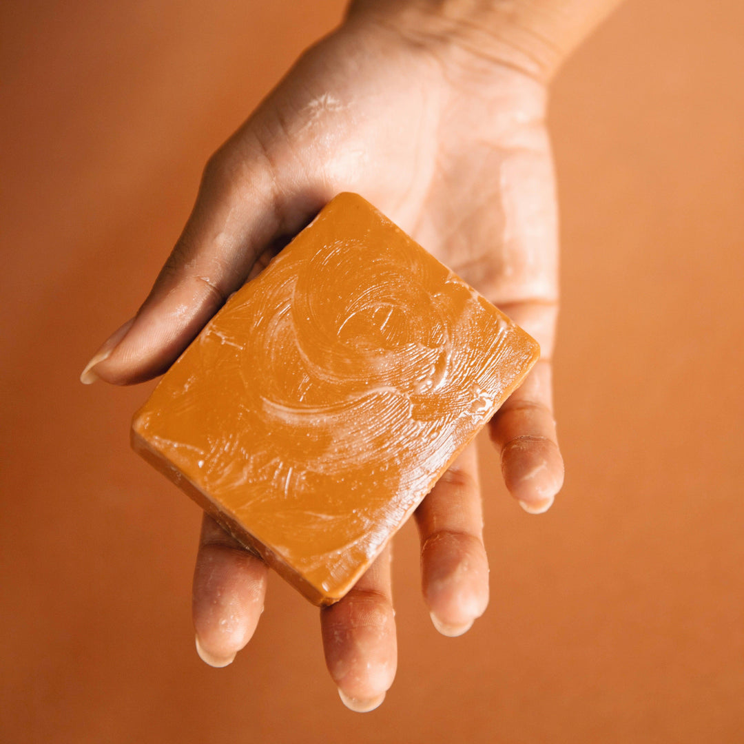 Moonglow soap bar wrapped in eco-friendly kraft paper packaging on a white background.