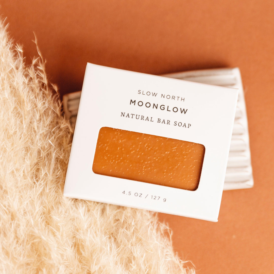 Moonglow bar soap shown with a rustic appearance and herbal styling.