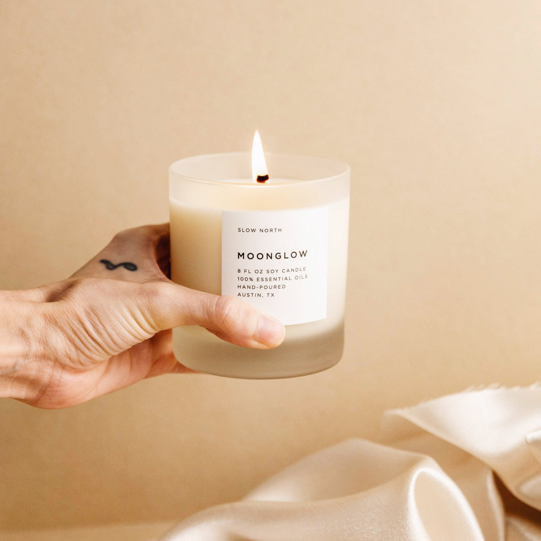 8 oz Moonglow signature candle with warm patchouli and cinnamon scent.
