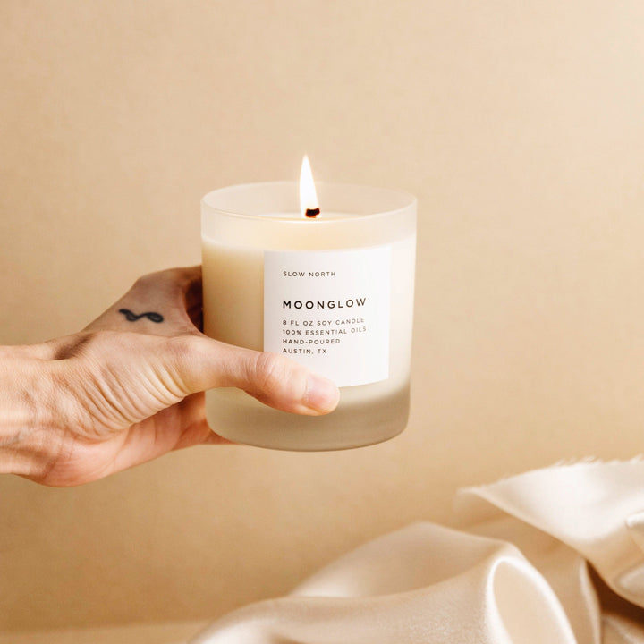8 oz Moonglow signature candle with warm patchouli and cinnamon scent.
