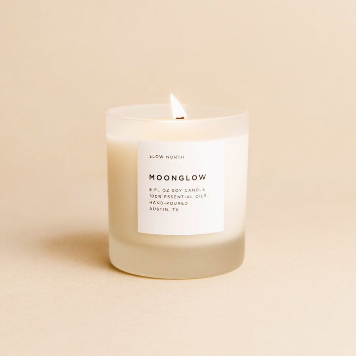 8 oz Moonglow candle with patchouli, cinnamon, and black pepper essential oils.