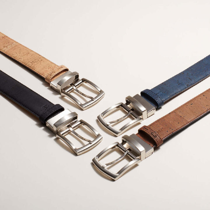 Reversible cork belt with brown and navy sides, a metal buckle, and natural cork texture.