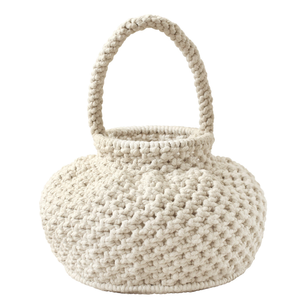 Off-white macrame bucket bag with a woven design and drawstring closure, displayed against a neutral background.