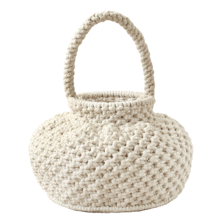 Off-white macrame bucket bag with a woven design and drawstring closure, displayed against a neutral background.