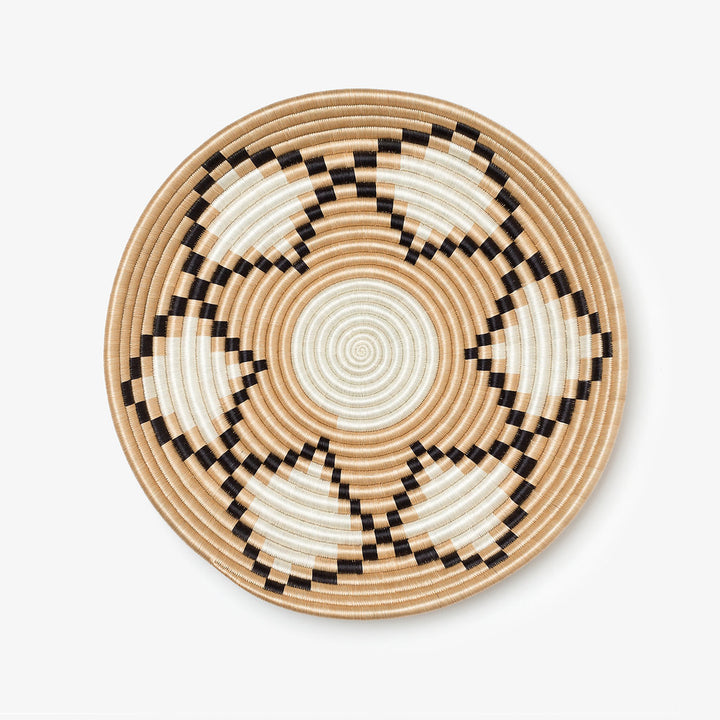 Overhead view of Neri natural sisal woven bowls with a stepped sunburst pattern.