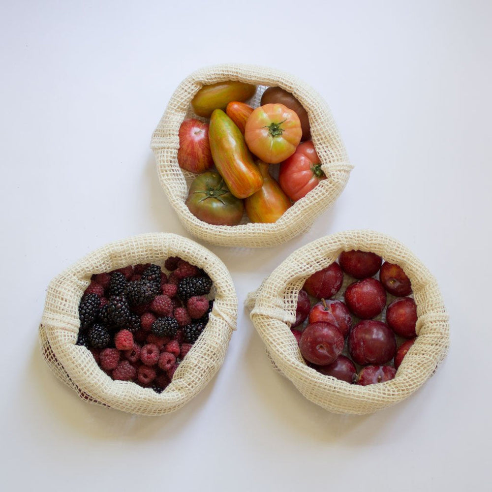 Set of two organic cotton mesh bags with breathable, lightweight mesh and drawstring closures.