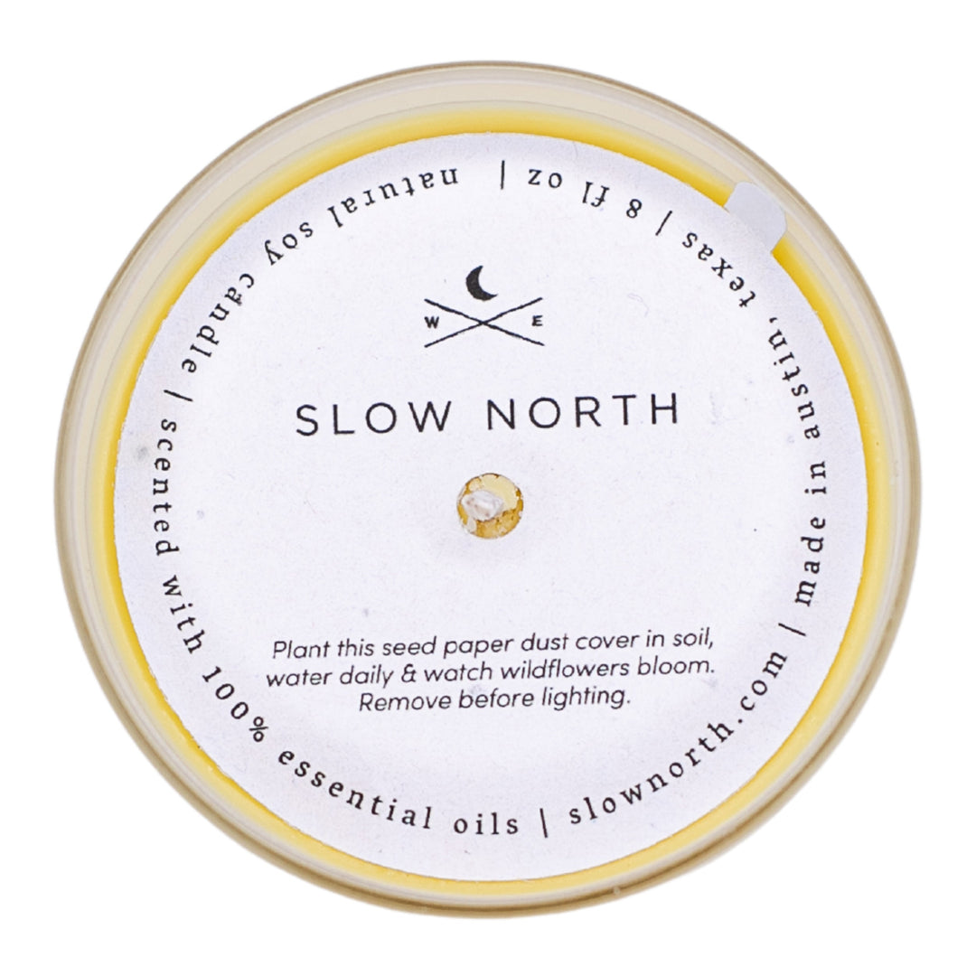 Hello Sunshine citrus blend candle with yellow dust cover on the jar.