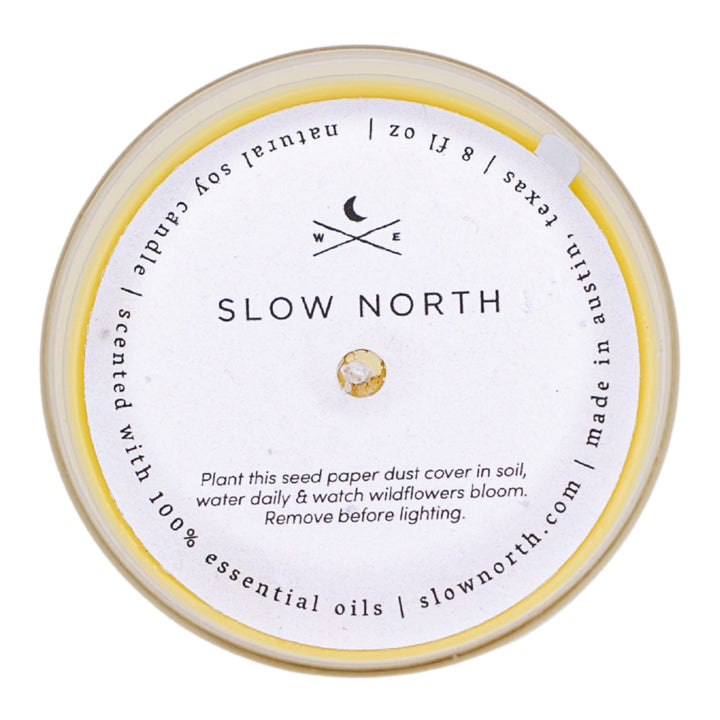 Hello Sunshine citrus blend candle with yellow dust cover on the jar.