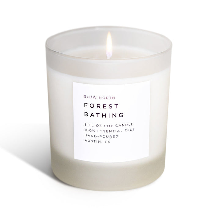 Forest Bathing signature candle with fir, pine, and patchouli essential oil blend.