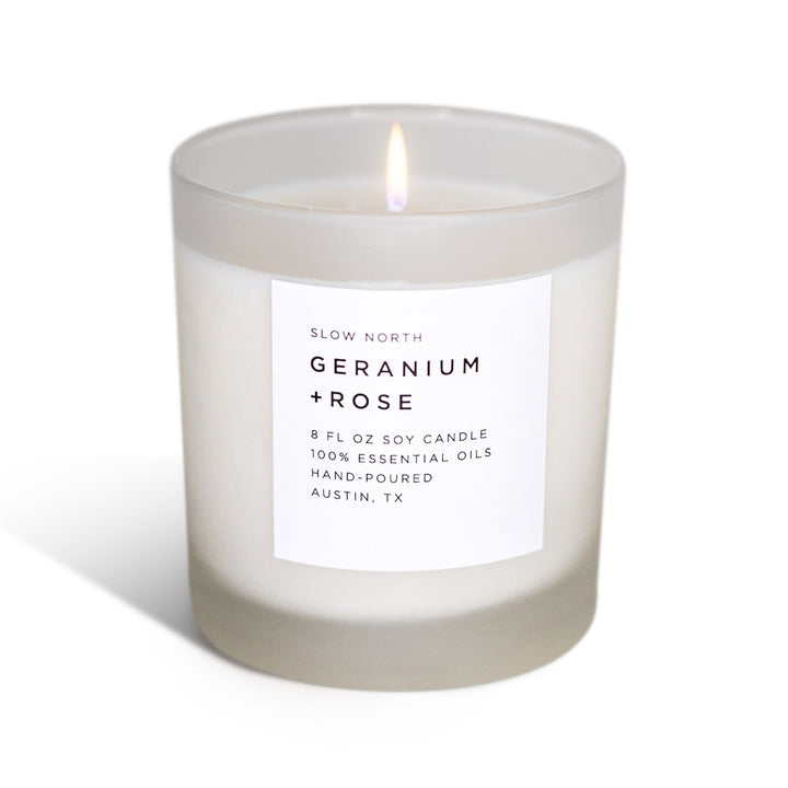 Geranium Rose signature candle with floral rose scent in a glass jar.