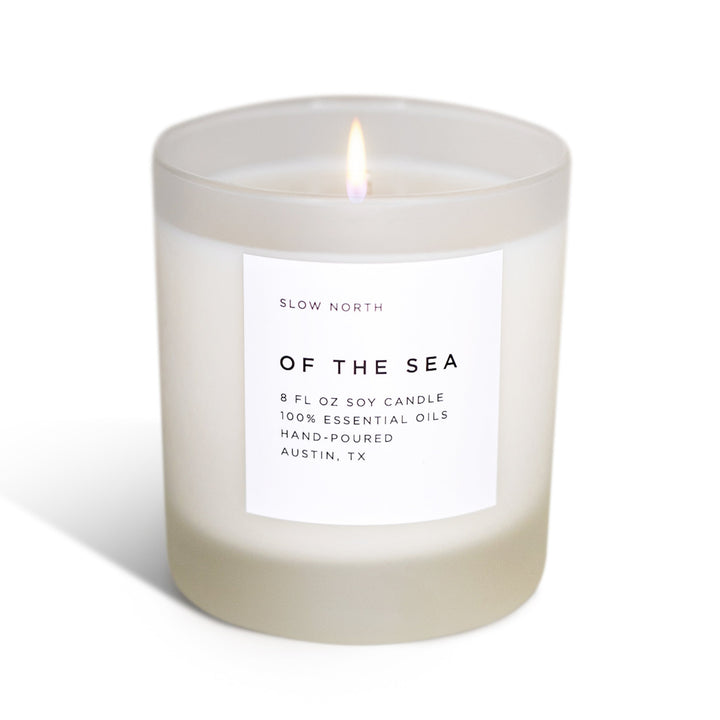 Of The Sea signature candle with eucalyptus and lavender scent in a glass jar.