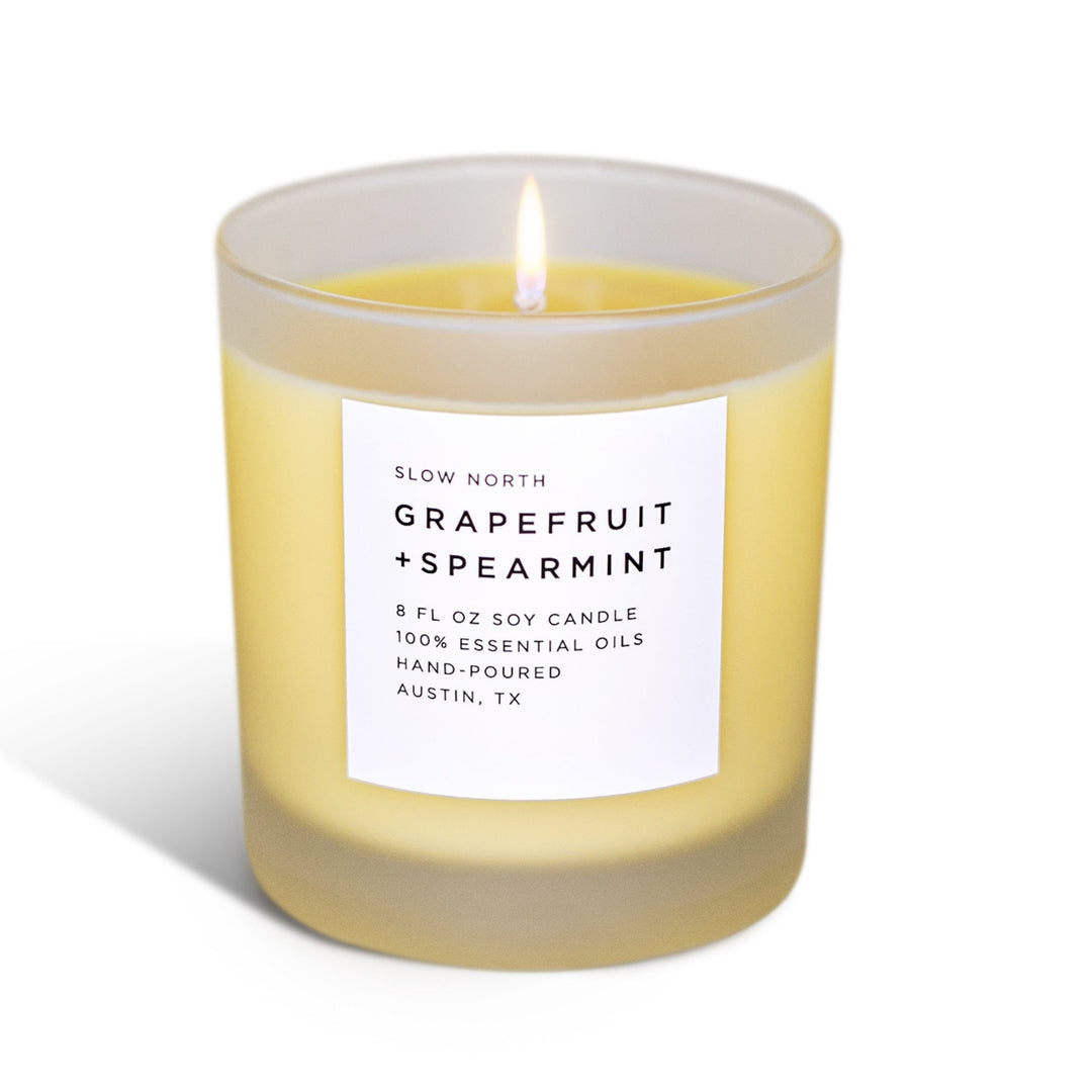 Fresh Citrus Candle Trio with three scented soy candles in glass holders.
