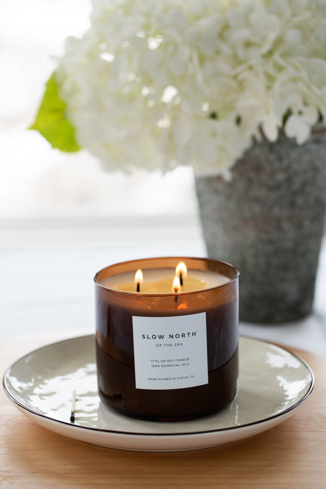 Of The Sea three-wick candle with a serene ocean-inspired design.