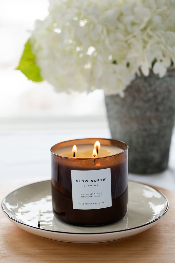 Of The Sea three-wick candle with a serene ocean-inspired design.