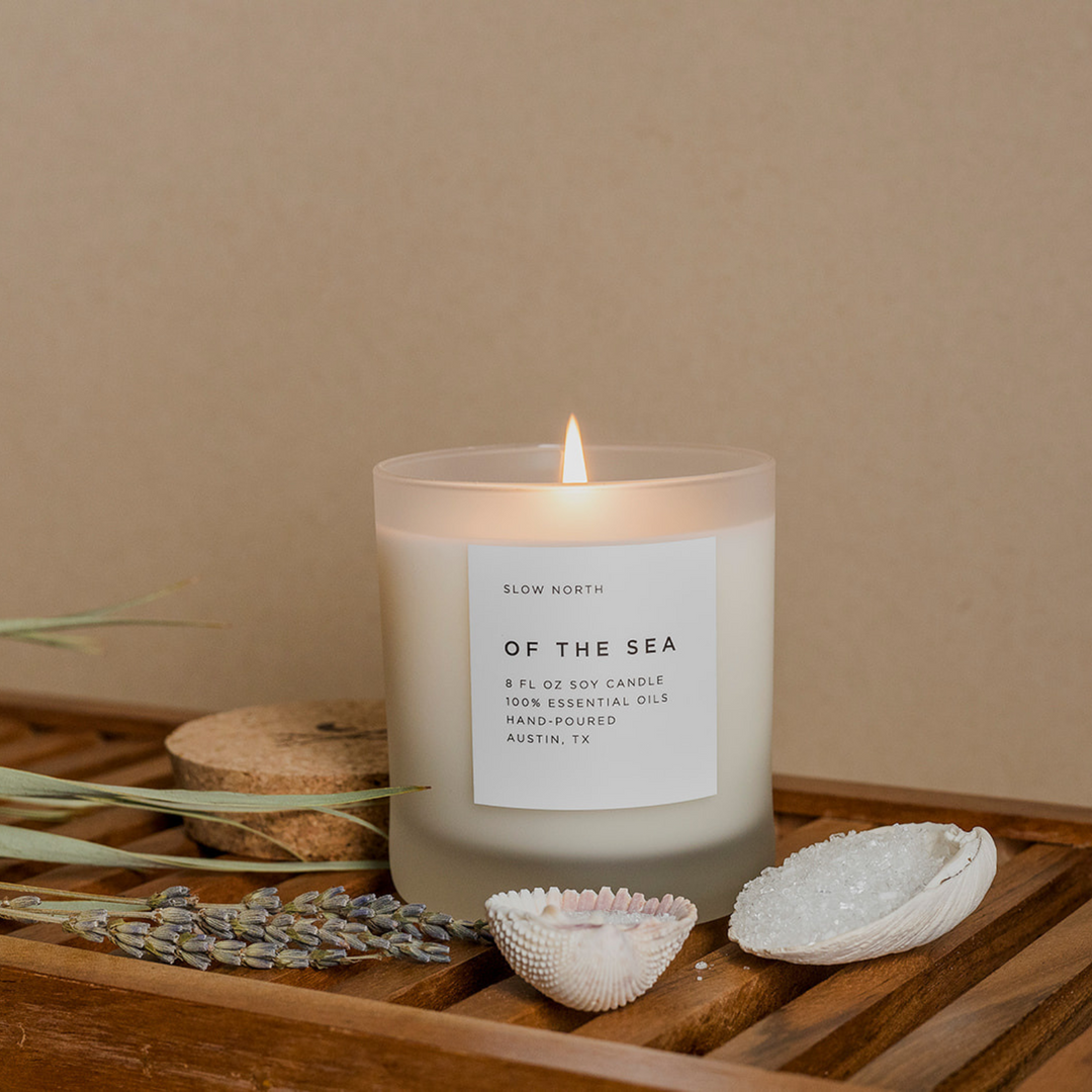8 oz Of The Sea signature candle with eucalyptus, lavender, and peppermint scents.