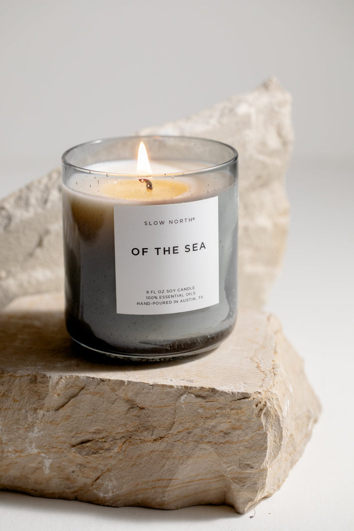 Of The Sea Spa Collection candle with eucalyptus and lavender in a smokey grey bubble glass vessel.