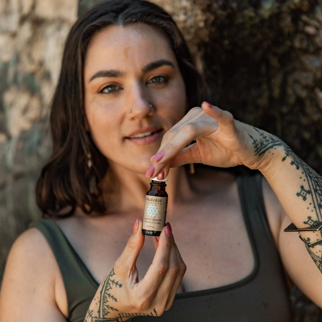 Organic Clarify face serum in a glass dropper bottle.