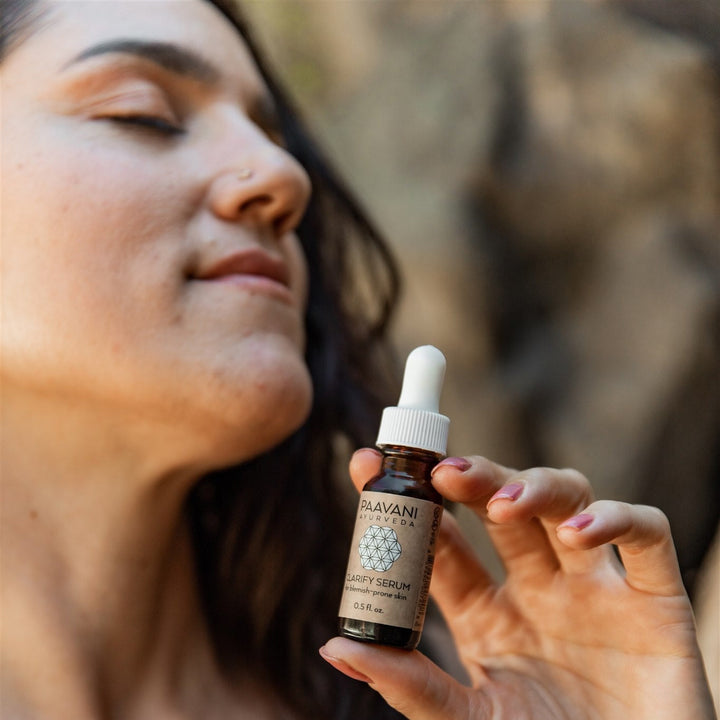 Organic Clarify face serum in a clear glass dropper bottle.