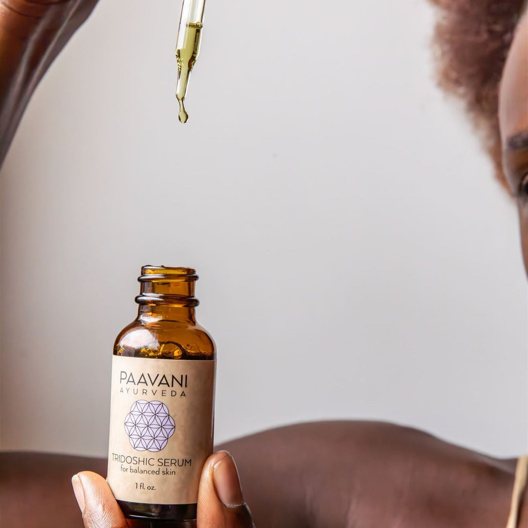 Tridoshic Ayurvedic face serum in a glass dropper bottle.