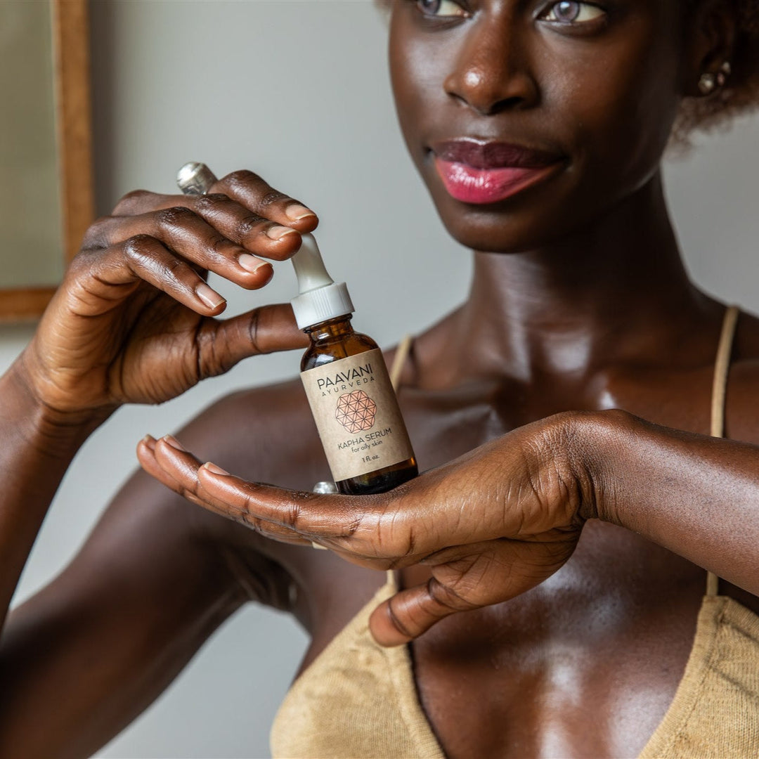 Bottle of Kapha Ayurvedic face oil with natural ingredients.