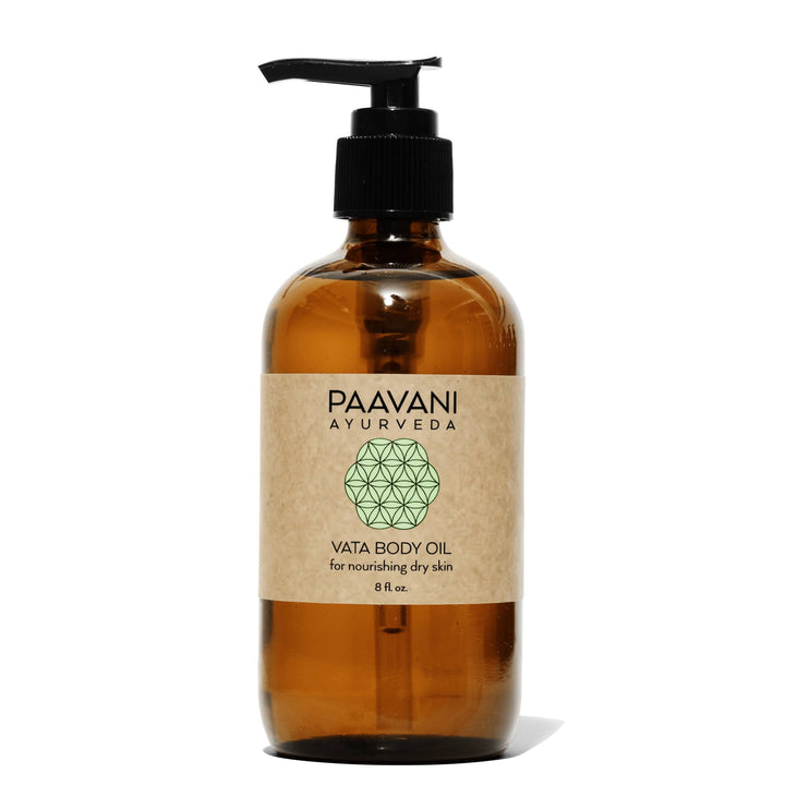 Vata body oil, an Ayurvedic abhyanga massage oil, in a glass bottle with dropper.