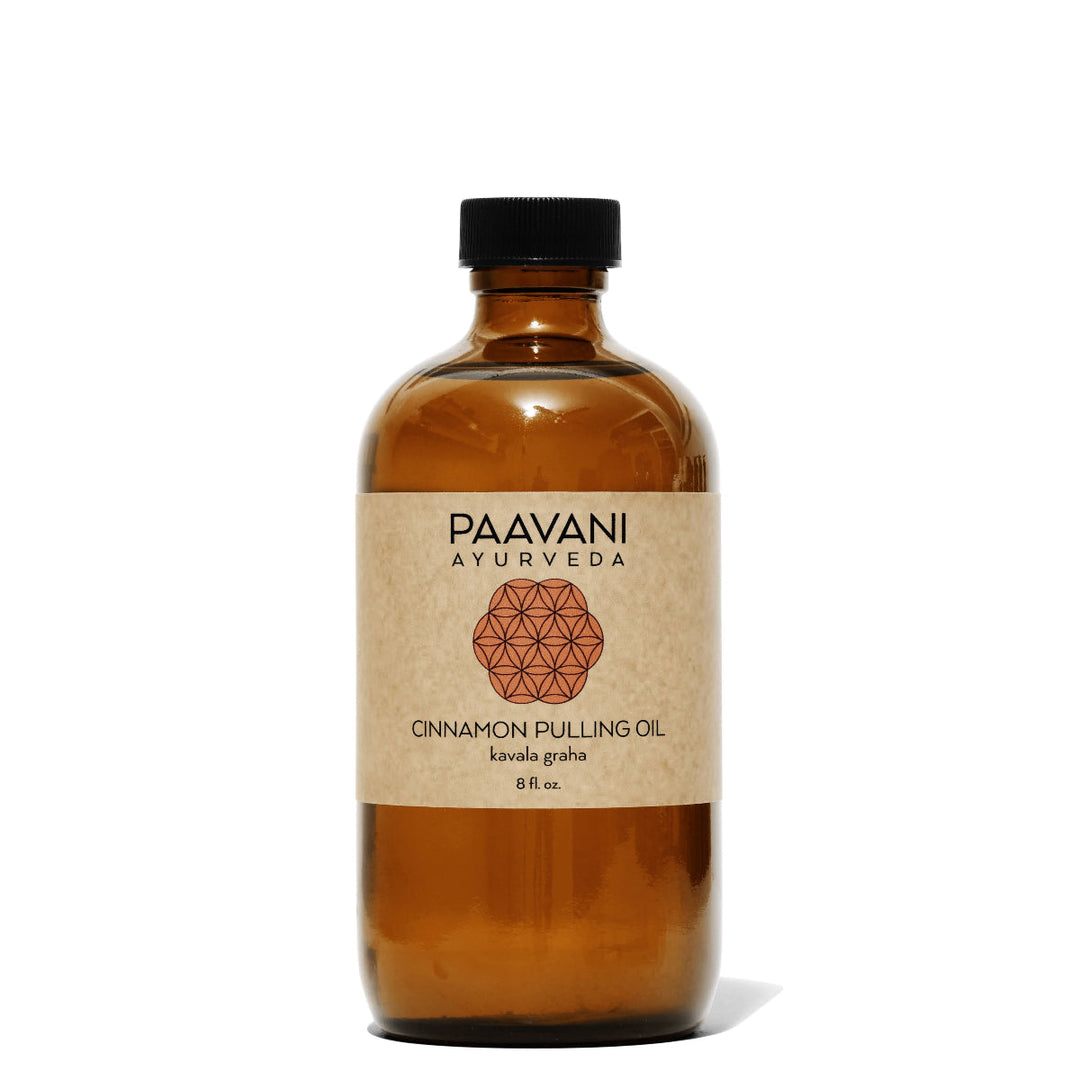 Cinnamon Ayurvedic oil-pulling blend with cinnamon sticks and herbal ingredients.