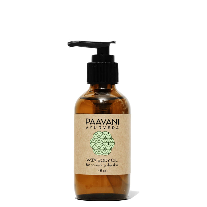 Vata body oil, Ayurvedic abhyanga oil, in a glass bottle with dropper.