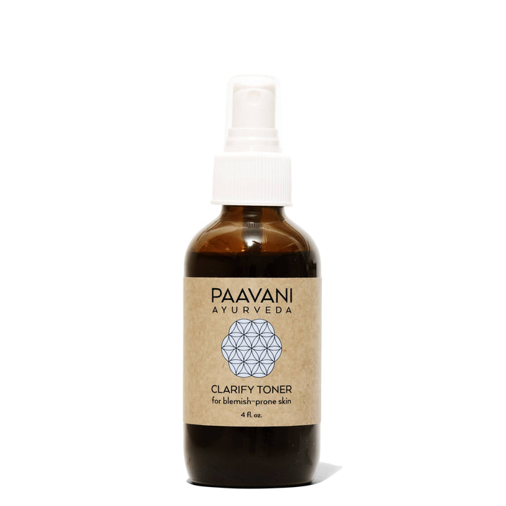 Clarify face toner with neem and rose in a clear bottle with a flip-top cap.