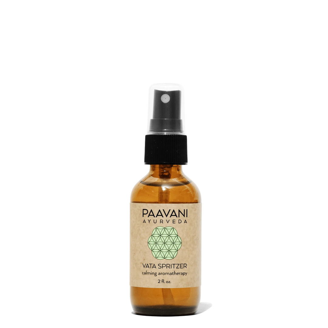 Vata aromatherapy spritzer with palo santo in a clear glass spray bottle.