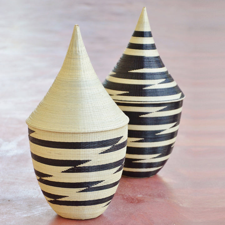Handwoven peace basket in white and black grass with intricate craftsmanship.