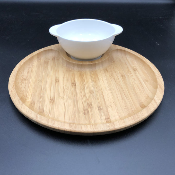 Single-serve porcelain bowl and bamboo tray, minimalist design.
